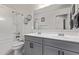 This bathroom boasts a double sink vanity and a shower-tub combination at 997 E White Wing Dr, Casa Grande, AZ 85122