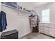 Walk-in closet with ample hanging space, shelving, and a dresser at 997 E White Wing Dr, Casa Grande, AZ 85122