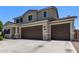 Two-story home featuring a two-car garage, desert landscaping, and a neutral color scheme at 997 E White Wing Dr, Casa Grande, AZ 85122