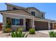 Well-maintained home featuring desert landscaping, charming accents, and a welcoming entrance at 997 E White Wing Dr, Casa Grande, AZ 85122