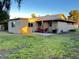 Charming backyard featuring a patio set on a well-maintained lawn, perfect for outdoor relaxation at 10726 W Kelso Dr, Sun City, AZ 85351