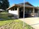 Carport attached to the house with grass yard at 10726 W Kelso Dr, Sun City, AZ 85351