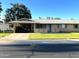 Charming single-story home featuring a carport, brick accents, and a well-maintained front lawn at 10726 W Kelso Dr, Sun City, AZ 85351