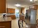 Spacious kitchen featuring granite counters, stainless steel appliances, and ample cabinet space at 10726 W Kelso Dr, Sun City, AZ 85351