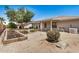 Spacious backyard with mature landscaping and a covered patio at 11033 E Keats Ave, Mesa, AZ 85209