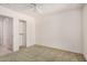 Neutral bedroom with a ceiling fan, closet, and lots of natural light at 11033 E Keats Ave, Mesa, AZ 85209