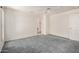 Bedroom features plush carpeting, ceiling fan, and an ensuite bathroom and walk-in closet at 11033 E Keats Ave, Mesa, AZ 85209