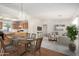Bright living room boasts an open floor plan, wood floors, and modern decor at 11033 E Keats Ave, Mesa, AZ 85209