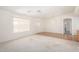Bright living room features carpet and hard surface flooring, neutral walls, a ceiling fan and natural light at 11033 E Keats Ave, Mesa, AZ 85209