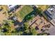 Expansive backyard with a lush lawn, mature trees, detached garage, and convenient access to amenities at 11143 E Vallejo St, Chandler, AZ 85248