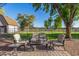 Comfortable backyard seating area with pavers, outdoor furniture, and lush lawn at 11143 E Vallejo St, Chandler, AZ 85248
