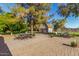 Relaxing brick patio with outdoor furniture and a detached garage at 11143 E Vallejo St, Chandler, AZ 85248