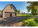 This property includes a large barn with two garage doors and ample parking at 11143 E Vallejo St, Chandler, AZ 85248