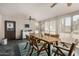 The dining area includes lots of natural light, neutral paint, tile flooring, and a ceiling fan at 11143 E Vallejo St, Chandler, AZ 85248