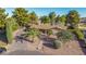 Landscaped ranch home featuring mature trees and desert landscaping for low maintenance curb appeal at 11143 E Vallejo St, Chandler, AZ 85248