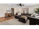 Bright living room featuring stylish sectional sofa, neutral walls, and a wood-trimmed doorway at 11143 E Vallejo St, Chandler, AZ 85248