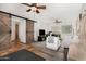 Spacious living room with ceiling fans, barn door, wood beam and comfortable seating at 11143 E Vallejo St, Chandler, AZ 85248