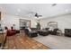 Spacious living room featuring large sectional sofa and an abundance of natural light at 11143 E Vallejo St, Chandler, AZ 85248