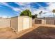 Backyard featuring a shed and block fence at 1228 E Fremont Dr, Tempe, AZ 85282