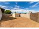 View of the backyard with a shed and block fence at 1228 E Fremont Dr, Tempe, AZ 85282
