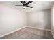 This bedroom has neutral walls and carpeting with modern ceiling fan at 1228 E Fremont Dr, Tempe, AZ 85282