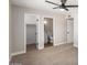 Carpeted bedroom with ensuite bathroom and walk-in closet at 1228 E Fremont Dr, Tempe, AZ 85282