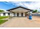 Wide carport with enclosed storage and front lawn at 1228 E Fremont Dr, Tempe, AZ 85282
