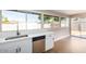 Features new stainless-steel dishwasher and sink with garden view at 1228 E Fremont Dr, Tempe, AZ 85282