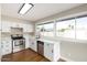 Updated kitchen showcasing stainless steel appliances, new cabinets, and natural light at 1228 E Fremont Dr, Tempe, AZ 85282