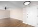 Bright living room featuring updated flooring, ceiling fan and a new front door at 1228 E Fremont Dr, Tempe, AZ 85282