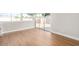 Inviting living room with wood-look floors, sliding glass door, and a cozy ambiance at 1228 E Fremont Dr, Tempe, AZ 85282
