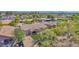 Expansive backyard with covered patio, artificial grass, desert landscaping, and privacy fence at 1336 E Belmont Ave, Phoenix, AZ 85020