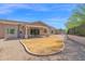 Expansive backyard featuring a covered patio, desert landscaping, and a defined space for a lawn at 1336 E Belmont Ave, Phoenix, AZ 85020