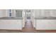 Bathroom featuring dual sinks, stone countertops and wood look tile flooring at 1336 E Belmont Ave, Phoenix, AZ 85020