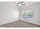 Bright, neutrally decorated bedroom featuring a ceiling fan and carpeted floors at 1336 E Belmont Ave, Phoenix, AZ 85020