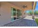 The covered patio features a ceiling fan, lighting, and access to the backyard through sliding glass doors at 1336 E Belmont Ave, Phoenix, AZ 85020
