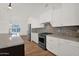 Gourmet kitchen featuring stainless steel appliances, granite countertops, and ample cabinet space at 1336 E Belmont Ave, Phoenix, AZ 85020