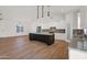 Spacious kitchen features a large island with dark cabinets and modern pendant lighting above at 1336 E Belmont Ave, Phoenix, AZ 85020