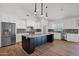 Bright, spacious kitchen featuring stainless steel appliances, a large island, and stylish backsplash at 1336 E Belmont Ave, Phoenix, AZ 85020