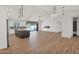 Bright open-concept living space with fireplace and access to the kitchen and backyard at 1336 E Belmont Ave, Phoenix, AZ 85020
