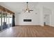 Bright, airy living room with a cozy fireplace and sliding glass doors to the backyard at 1336 E Belmont Ave, Phoenix, AZ 85020