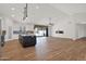 Bright open-concept living space with fireplace and access to the kitchen and backyard at 1336 E Belmont Ave, Phoenix, AZ 85020