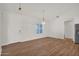 Spacious living room with hardwood floors, abundant natural light, and elegant chandelier at 1336 E Belmont Ave, Phoenix, AZ 85020