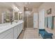 Spacious bathroom with double vanity, ample counter space, and a glass-enclosed shower at 14200 W Village Pkwy # 2128, Litchfield Park, AZ 85340
