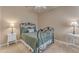 Simple bedroom with iron bed frame and neutral decor at 14200 W Village Pkwy # 2128, Litchfield Park, AZ 85340