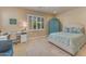 Cozy bedroom features a bright window, neutral colors, and a desk area at 14200 W Village Pkwy # 2128, Litchfield Park, AZ 85340