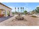 Beautiful community pool area surrounded by lounge chairs and palm trees, perfect for relaxation at 14200 W Village Pkwy # 2128, Litchfield Park, AZ 85340