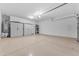 Spacious two car garage with ample storage and plenty of room for cars and projects at 14200 W Village Pkwy # 2128, Litchfield Park, AZ 85340