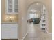 Hallway that offers a view into a living room and a glimpse of the kitchen with tile flooring at 14200 W Village Pkwy # 2128, Litchfield Park, AZ 85340