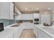 Contemporary kitchen with white cabinets, stainless steel appliances, and a gas cooktop for culinary enthusiasts at 14200 W Village Pkwy # 2128, Litchfield Park, AZ 85340
